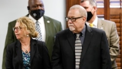 Gregory McMichael stands next to his attorney as he attends the jury selection in his trial together with Travis McMichael and their neighbor, William "Roddie" Bryan, at Gwynn County Superior Court, in Brunswick, Georgia, Oct. 27, 2021.