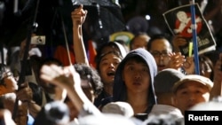 Protestors demonstrate against changes to Japan's security laws in front of Parliament in Tokyo on September 16, 2015.