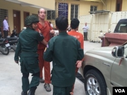 FILE - Australian filmmaker James Ricketson, who is accused of espionage, appears at the Supreme Court in Phnom Penh, Jan. 17, 2018.