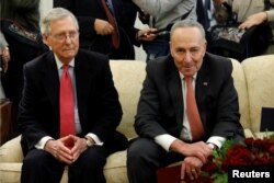 Senate Majority Leader Mitch McConnell and Senate Minority Leader Chuck Schumer take part in a meeting with U.S. President Donald Trump and other Congressional leaders in the Oval Office of the White House in Washington, U.S., Dec. 7, 2017.