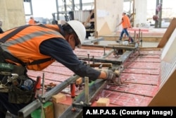 A construction worker at the Academy Museum of Motion Pictures site in Hollywood.