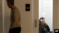 FILE - Members of the The Riveter, a women-focused shared workspace facility, are seen work in Seattle, Washington, Jan. 11, 2019.