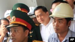 FILE - Businessman Phan Van Anh Vu (C) is seen at a local event in the central Vietnamese coastal city of Da Nang, April 29, 2016.