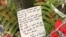 A note to the victims of Friday's mass shooting was placed alongside 50 red paper hearts near the Al Noor mosque in Christchurch, New Zealand, March 18, 2019.