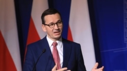 FILE - Poland's Prime Minister Mateusz Morawiecki speaks during a press conference in Vilnius, Lithuania, Sept. 17, 2020.
