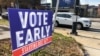 A sign in an Atlanta neighborhood on Dec. 11, 2020, urges people to vote early in Georgia's two U.S. Senate races. 