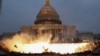 An explosion caused by a police munition is seen while supporters of U.S. President Donald Trump gather in front of the U.S. Capitol Building in Washington, Jan. 6, 2021. 
