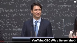 Canadian Prime Minister Justin Trudeau speaks with reporters about quantum computing during an event at a physics research lab in Ontario in April 2016.