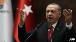 Presiden Turki Recep Tayyip Erdogan berpidato di depan anggota parlemen di Ankara, Selasa (5/12). 