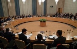 FILE - Participants attend a conference on Afghanistan bringing together representatives of Afghan authorities and the Taliban in Moscow, Russia, Nov. 9, 2018.