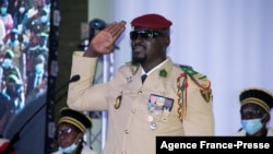 Guinea junta leader Mamadi Doumbouya is sworn in as interim president in Conakry, Guinea on Oct. 1, 2021.