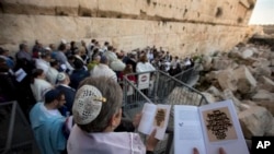 American and Israeli Reform rabbis pray in the Western Wall, the holiest site where Jews can pray in Jerusalem's old city. A recent gathering of American Reform rabbis in Jerusalem was meant to celebrate the small gains the liberal Jewish movement has made in Israel in recent years. (AP Photo/Sebastian Scheiner)