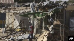 Police say Boko Haram militants staged attack in Kano, Nigeria Jan 24, 2011 which left this market in ruins and left at lead 185 people dead