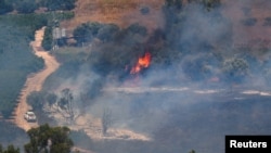 A fire blazes on the Israeli side of the Israel-Lebanon border following attacks from Lebanon, amid cross-border hostilities between Hezbollah and Israeli forces, in northern Israel, June 18, 2024.