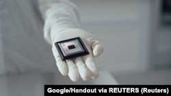 A person shows Google Quantum AI's "Willow" chip, in this undated handout photo obtained by Reuters on December 6, 2024. (Handout via REUTERS)
