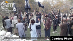 FILE - Fighters with IS-Khorasan, the affiliate in Afghanistan, vow allegiance to Islamic State's then-leader, Abu Ibrahim al-Hashimi al-Qurashi, in this photo issued Nov. 5, 2019, by SITE Intelligence Group.