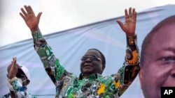 Former president Henri Konan Bedie, 86, gestures to supporters at a rally to celebrate his presidential candidacy for the opposition PDCI-RDA party in Yamoussoukro, Ivory Coast, Sept. 12, 2020.
