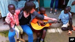 Dave Chapman with children at the Divine Providence Children's Home in Kakamega, Kenya