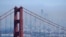 The San Francisco skyline is obscured by smoke from wildfires, as the Golden Gate Bridge rises in the foreground, Aug. 19, 2020, in this view from the Marin Headlands near Sausalito, Calif.