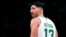 FILE - Boston Celtics center Enes Kanter Freedom looks toward the team's bench during the first half of an NBA basketball game Dec. 1, 2021, in Boston.