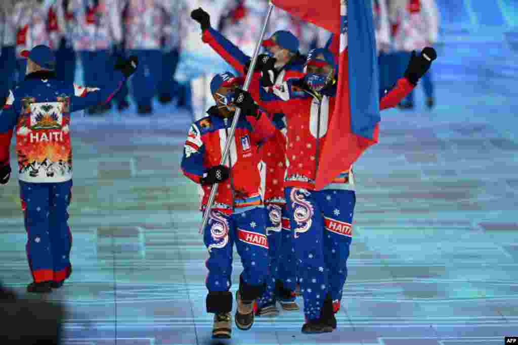 Haiti's flag bearer Richardson Viano leads the delegation during the opening ceremony of the Beijing 2022 Winter Olympic Games.