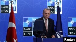 FILE - Turkey's President Recep Tayyip Erdogan holds a news conference during the NATO summit at the alliance's headquarters in Brussels, Belgium, June 14, 2021. 