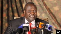 FILE - South Sudan rebel leader Riek Machar addresses journalists during a news conference in Nairobi, Kenya, July 8, 2015. 