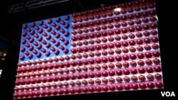 The Super Bowl is the most-watched American sporting event of the year. This American flag has been decorated with Wilson footballs. The company manufactures every football that is used by the NFL. (B. Allen/VOA)