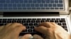 FILE - Hands type on a computer keyboard in Los Angeles, Feb. 27, 2013.