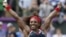 Serena Williams of the U.S. celebrates after winning the women's singles gold medal match against Russia's Maria Sharapova at the All England Lawn Tennis Club during the London 2012 Olympic Games August 4, 2012.