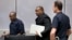 Jean-Pierre Bemba enters the courtroom of the International Criminal Court in The Hague, Netherlands, March 21, 2016. The court's judges handed him a guilty verdict.