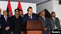 Libya's new Prime Minister Ahmed Maitiq speaks at a news conference with members of the government in Tripoli, Libya, June 2, 2014. 