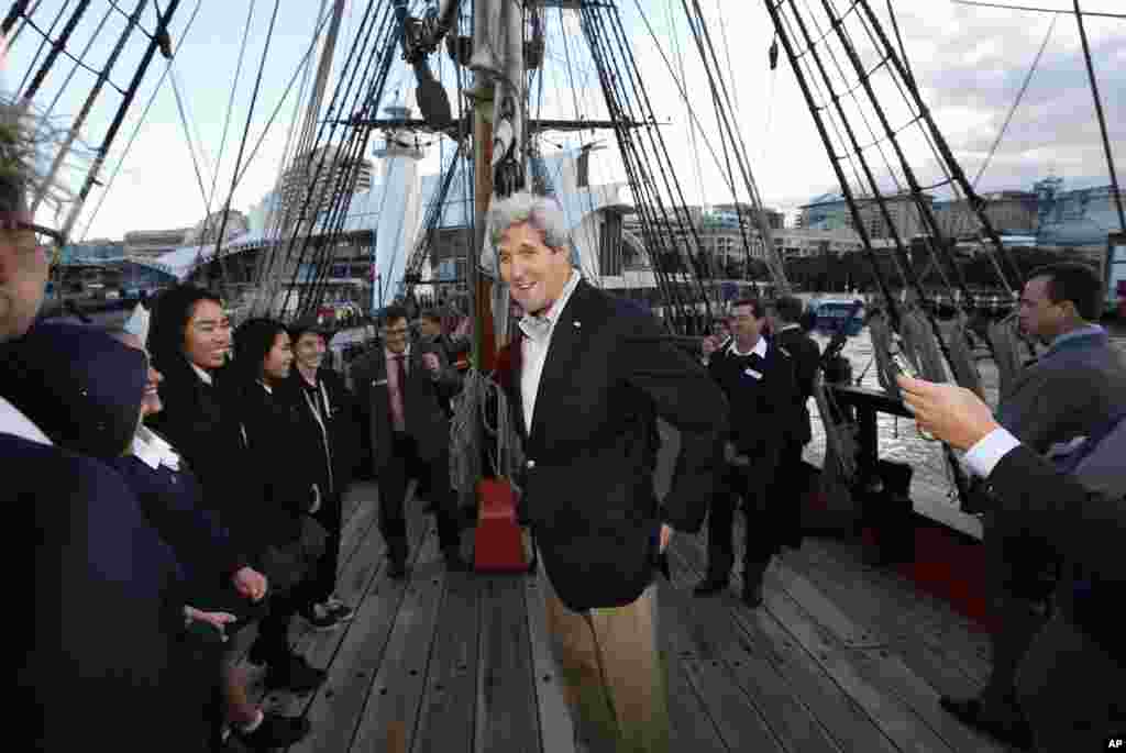U.S. Secretary of State John Kerry meets students from several Sydney high schools during his visit aboard a replica of Captain Cook's ship 'Endeavour' at the Australian National Maritime Museum in Sydney, Australia, Aug. 11, 2014.
