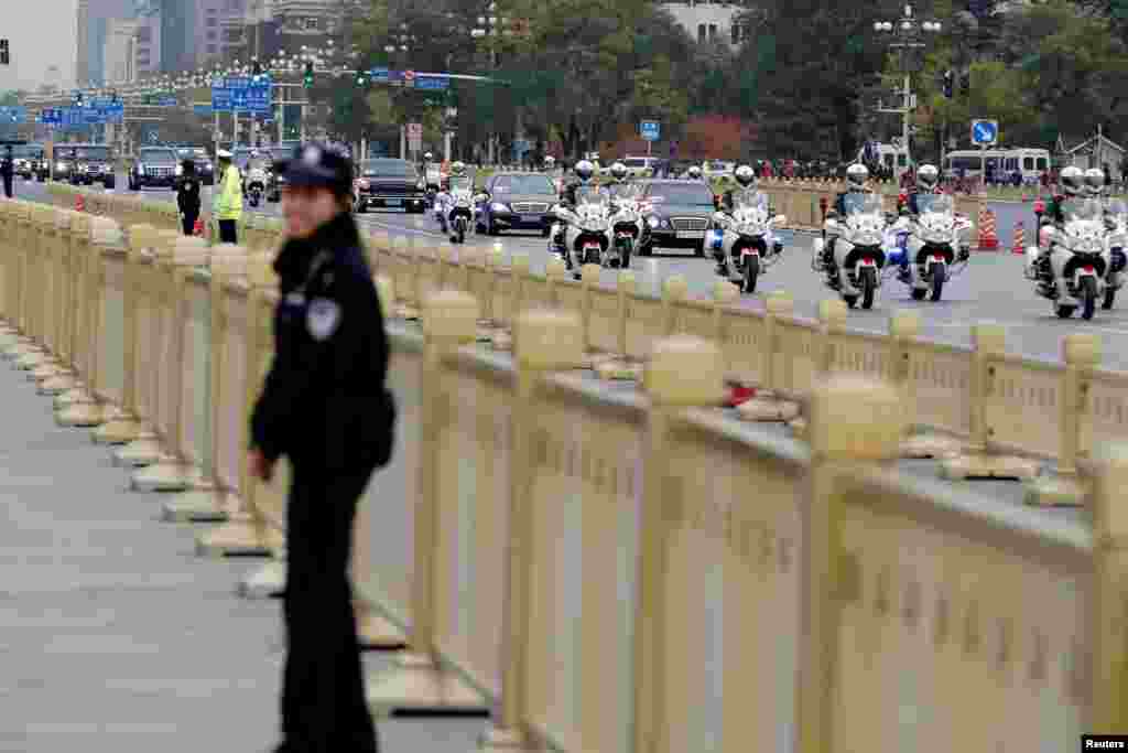 A motorcade carrying U.S. President Donald Trump arrives at Tiananmen square in Beijing, China, Nov. 8, 2017.