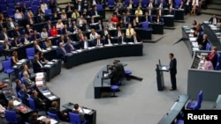 A lawmaker addresses a session of the Bundestag, Germany's lower house of parliament, ahead of the approval of a resolution declaring the 1915 massacre of Armenians by Ottoman Turk forces a "genocide," in Berlin, Germany, June 2, 2016. 