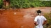An Indigenous man from the Pataxo Ha-ha-hae tribe looks at Paraopeba river, after a tailings dam owned by Brazilian mining company Vale SA collapsed, in Sao Joaquim de Bicas near Brumadinho, Brazil, Jan. 25, 2019. 