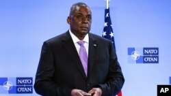 FILE - Secretary of Defense Lloyd Austin at NATO headquarters in Brussels. The AP has learned that a Pentagon panel is recommending that decisions to prosecute service members for sexual assault be made by independent authorities, not commanders.