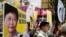 Protesters raise placards and banner during a rally against Hong Kong's former Chief Secretary Carrie Lam in Hong Kong, Feb. 5, 2017. 