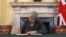 Britain's Prime Minister Theresa May signs the official letter to European Council President Donald Tusk, in 10 Downing Street, London, March 28, 2017, invoking Article 50 of the bloc's key treaty, the formal start of exit negotiations. Britons voted in June to leave the bloc after four decades of membership. 