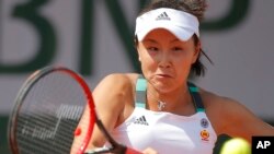 FILE - China's Shuai Peng plays a shot against Romania's Sorana Cirstea during their first round match of the French Open tennis tournament at the Roland Garros stadium, in Paris, France, May 30, 2017.