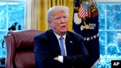 Presiden Amerika Serikat Donald Trump berbicara dalam wawancara dengan Reuters di Gedung Putih, Washington, AS, 17 Januari 2018.