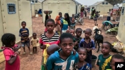Children of 6,000 ethnic Fulanis who have been displaced by attacks gather in a makeshift camp in Youba, Burkina Faso, April 20, 2020. The West African nation continues to be wracked by violence linked to Islamic extremists and local defense militias.