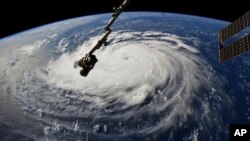 A photo provided by NASA shows Hurricane Florence from the International Space Station Sept. 10, 2018, as it barrels toward the U.S. East Coast.