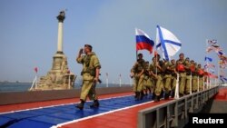 Germany's Eric Frenzel soars through the air during the ski jumping portion of the Nordic Combined, at the Nordic Ski World Championships in Innsbruck, Austria.