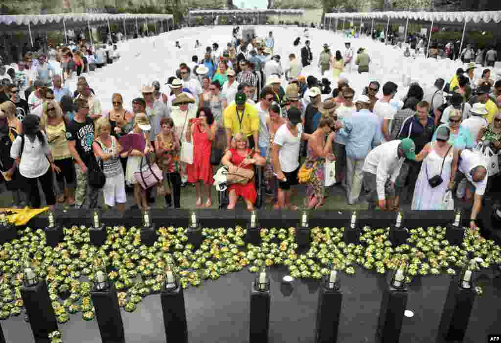Survivors and relatives of the victims of the 2002 Bali bombings attend a ceremony marking the 10th anniversary of the Bali attacks at the Garuda Wisnu Kencana cultural park in Jimbaran located in Indonesia's resort island of Bali, October 12, 2012.