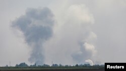 A view shows smoke rising above the area following an alleged explosion in the village of Mayskoye in the Dzhankoi district, Crimea, August 16, 2022. (REUTERS/Stringer)