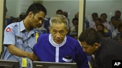 Kaing Guek Eav, alias Duch, who ran a prison where up to 16,000 people were tortured before being killed, before war crimes tribunal, Phnom Penh, Cambodia, March 19, 2012.
