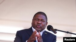 FILE - Mozambique's President Filipe Nyusi speaks during Armed Forces Day celebrations in Pemba, Mozambique, Sept. 25, 2021.