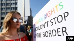 Pro-abortion protestors hold placards during a demonstration calling for abortion to be legalized in Northern Ireland, outside Belfast city hall in Belfast on May 28, 2018. 