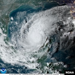This satellite image provided by NOAA shows the center of Milton moving East at 10 mph with maximum sustained winds of about 180 mph, Oct. 7, 2024.